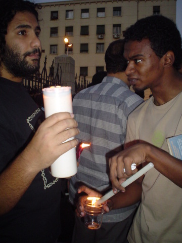 Lighting candles at a Black Friday protest